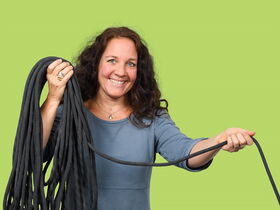 Portrait: Iris Grimm mit Kletterseil